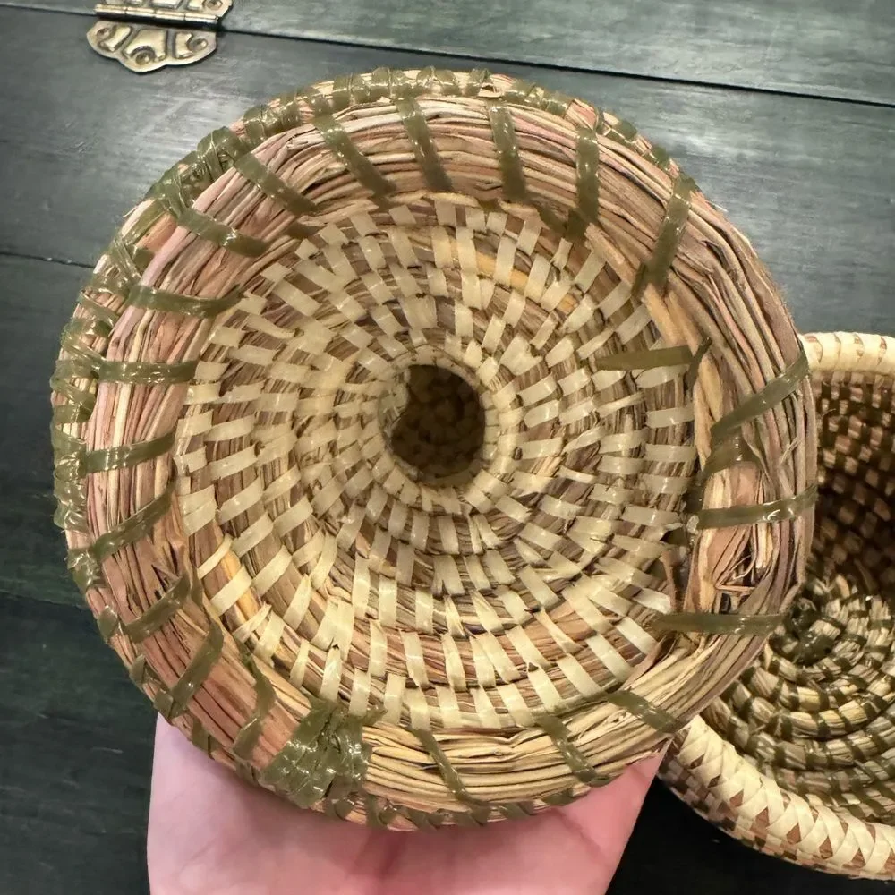 Handwoven sweetgrass coiled basket with a fitted lid